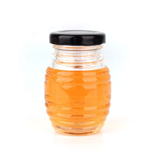 Factory sell stock empty 100ml bee honey glass jar for storage with metal twist off cap